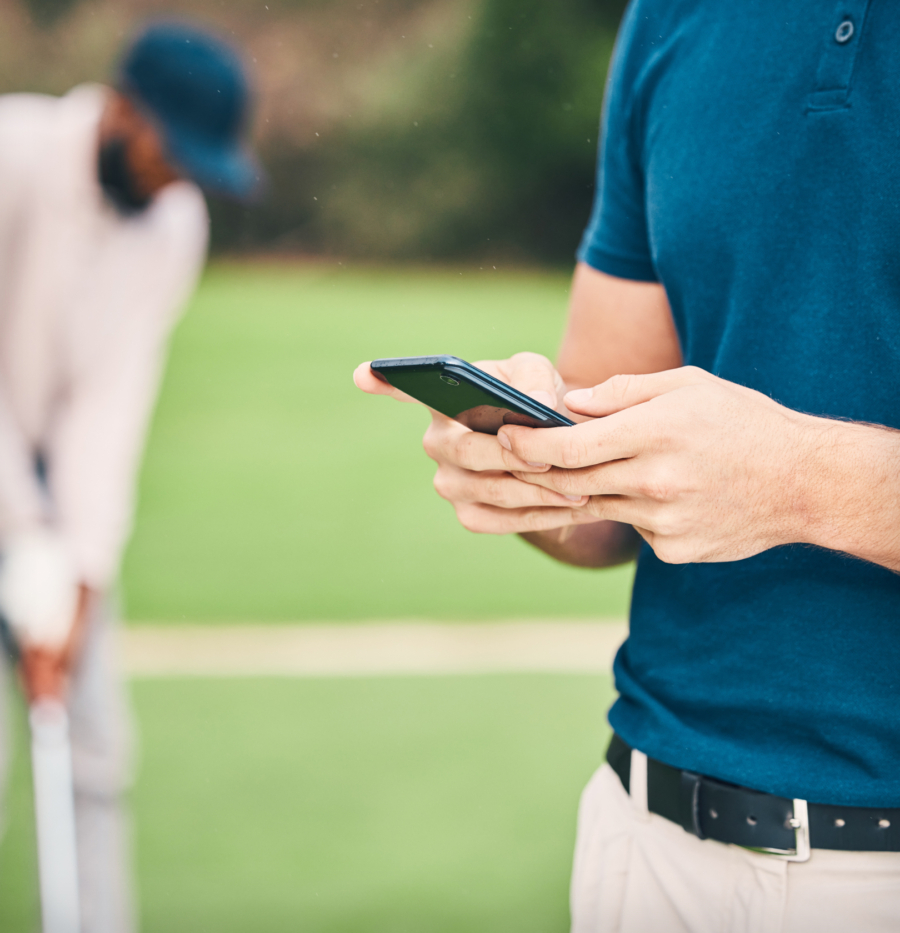 Image Right 1 2 Golf player checking tee sheet application on phone